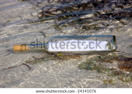 help message in a bottle floating on the ocean waves