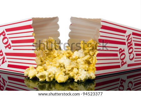 buttered popcorn spilling out of theater box
