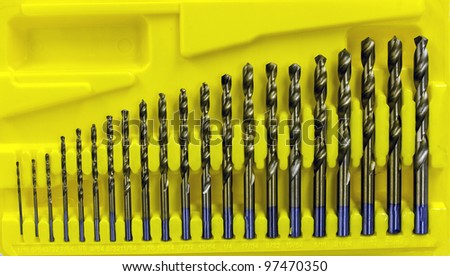 drill bits collection sized in a yellow plastic case