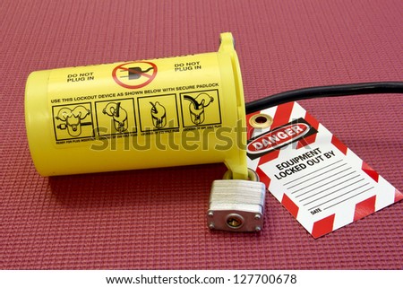 electrical cord secured in a lock out tag out container
