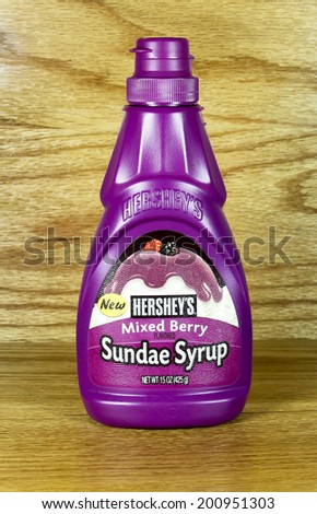 SPENCER , WISCONSIN June 25 , 2014:  bottle of Hershey\'s Mixed Berry Sundae Syrup. Hershey\'s was founded in 1894