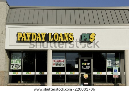 SPENCER , WISCONSIN Sept.28 , 2014: Payday Loans Sign on a Store Front. Payday Loans is a short term loan company.