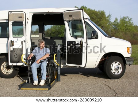 SPENCER , WISCONSIN, March, 12, 2015  Disabled man using a Ricon Wheelchair Lift to get into a van. Ricon introduced the Wheelchair Lift in 1971