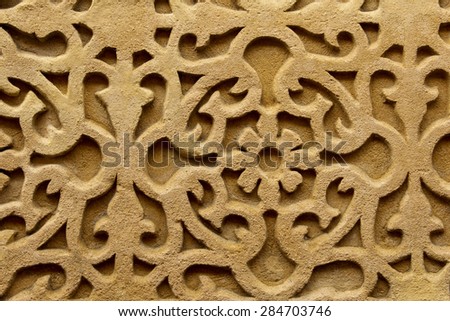 Relief wall carving from the ancient palace and fortress of Alhambra in Granada Spain makes a carving background
