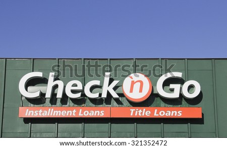 SPENCER , WISCONSIN, September, 28, 2015  Check n Go Sign on a Storefront . Check n Go is a quick cash loan company founded in 1994