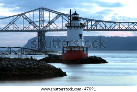Lighthouse and bridge at dusk