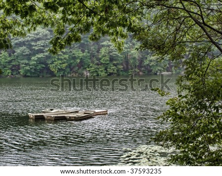 View of summer rental boats on a lake.