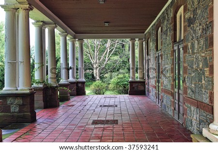View of back porch or veranda of historic Hudson Valley mansion.