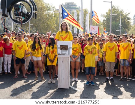 BARCELONA, SPAIN - SEPT. 11: Emma Sole whose 16th anniversary is in November 9 deposits a symbolic vote in the rally for the independence on Sept.11, 2014 in Barcelona, Spain.