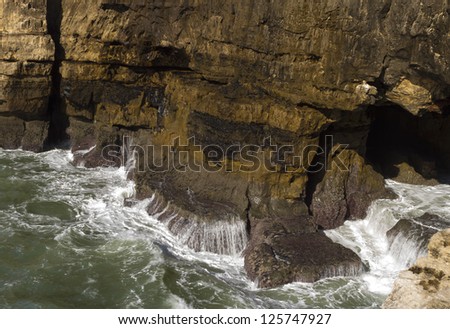 View of a wave breakers at a cliff