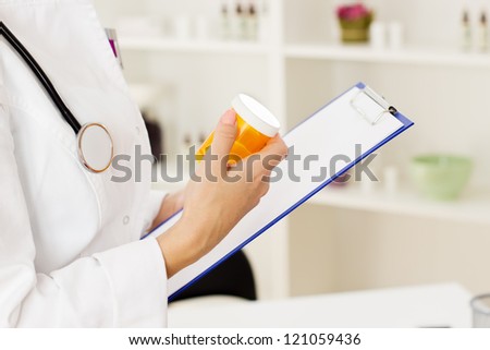 Closeup of female doctor hands Prescription Medicine.