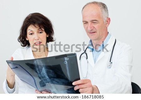 Doctors team looking at  x-ray image.