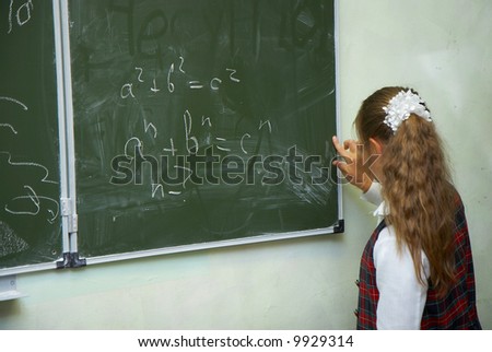 The pupil writes on a board