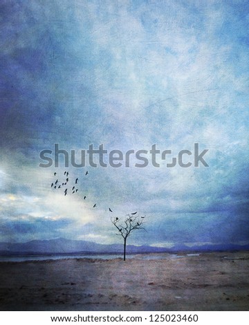 Blue landscape with lone tree and birds