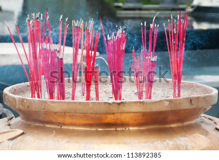 burning incense sticks in brass Incense bowl