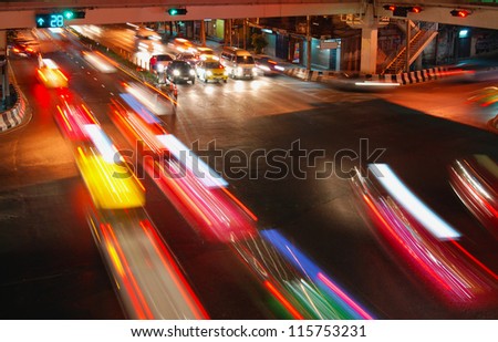 night speed traffic car light trail  at street junction of Bangkok City