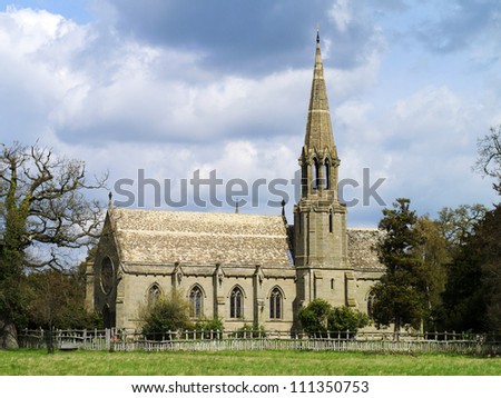 old church in the countryside with blue sky and clouds