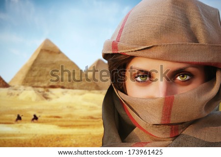 Beautiful Green Eyed Woman In Chador And The Pyramids