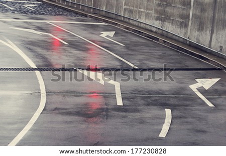 crossroads in the rain with traffic lights