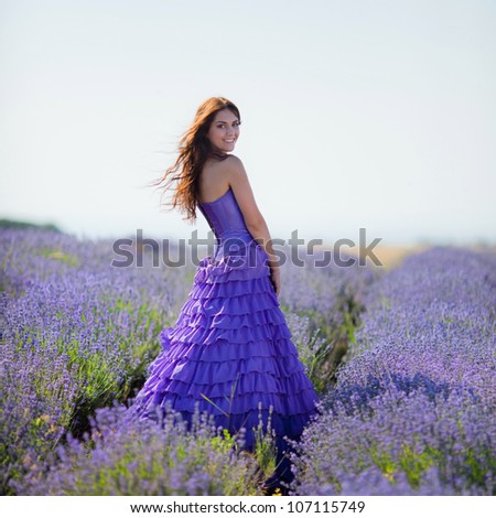 Series. Portrait of beautiful romantic woman in fairy field of lavender