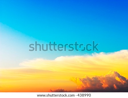 Blue sky with white, yellow and rose clouds
