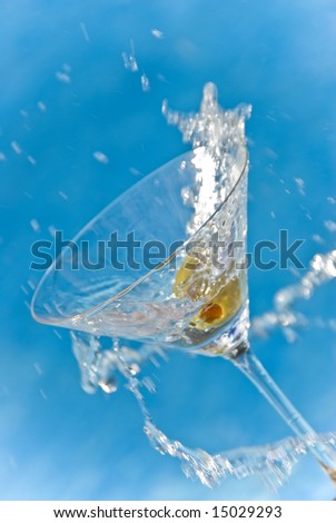 Martini Splash in Front of a Swimming Pool