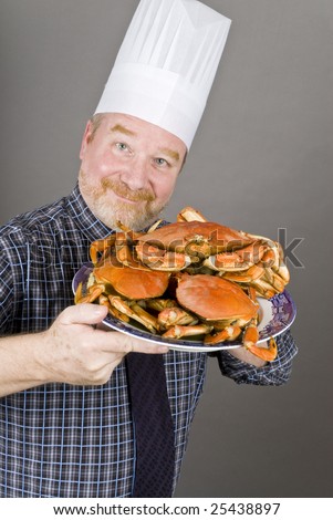 Chef with Cooked Dungeness Crabs