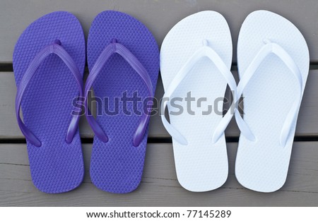 Two Pair of Flip Flops on the Deck
