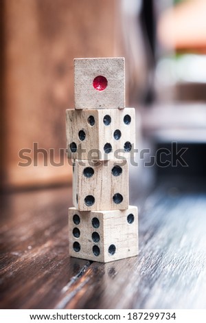 Wooden dices on on a old wood  floor