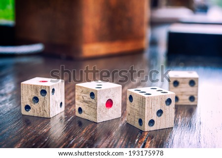 Wooden dices on on a old wood  floor