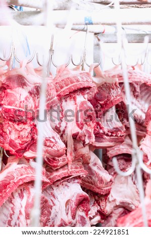 Butcher products. Processed pigs hanging in slaughter house industry