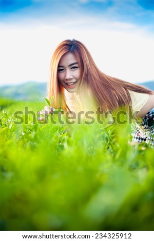 Smile Thai girl in tea plantation , Chiangrai Thailand