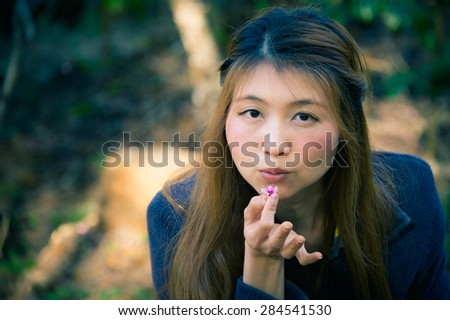 Asian woman with Himalayan Cherry Or Cherry blossom