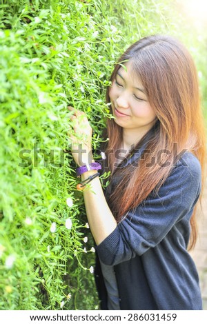 portrait asia young woman happy and smile on Doi tung garden, Dhiang rai, Thailand