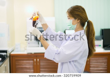 Bag of Blood in hand asian woman Doctor