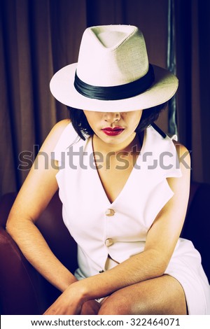 Portrait of beautiful young woman with white hat, , vintage effect