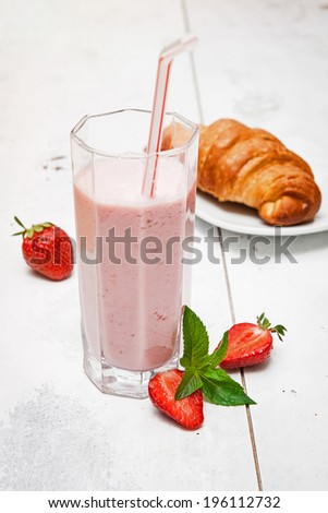 Healthy breakfast with homemade strawberry yogurt, croissant and fresh strawberries