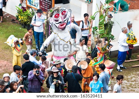 LOEI , Thailand - JULY  2 : Unidentified men wear ghost costumes at Ghost Festival (Phi Ta Khon - a masked procession celebrated by Buddhist)  on July 02, 2011 in Loei Province, Thailand.