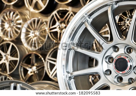 Various alloy wheels in store, selective focus.