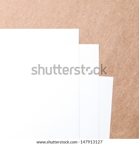 blank paper on brown paper backgound