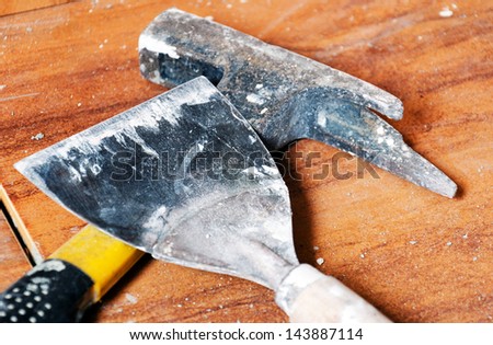 Hammer on floor tile( work tools)