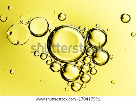 Oil drops on a water surface.
