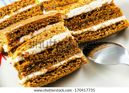 Pieces of honey cake on a plate.