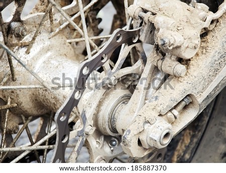 Enduro motorbike dirty rear wheel.  Closeup shot.