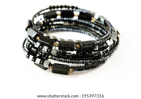 Black bracelets isolated over white background.
