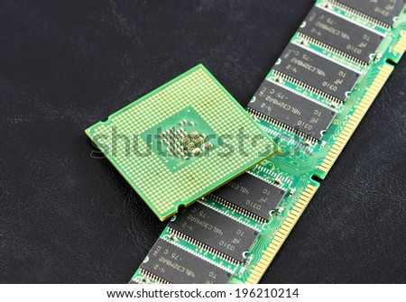 Computer CPU  and RAM module isolated on black background.