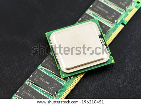 Computer CPU  and RAM module isolated on black background.