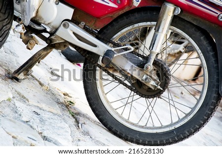 Rear wheel of a motorbike.