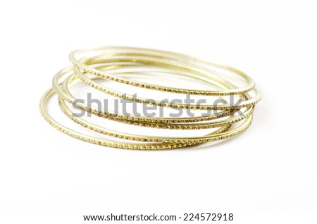 Golden bracelets isolated on white background.