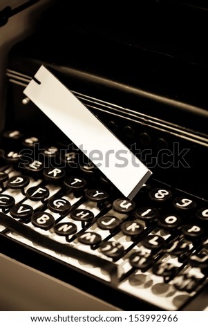 Vintage typewriter and white tag, shallow focus